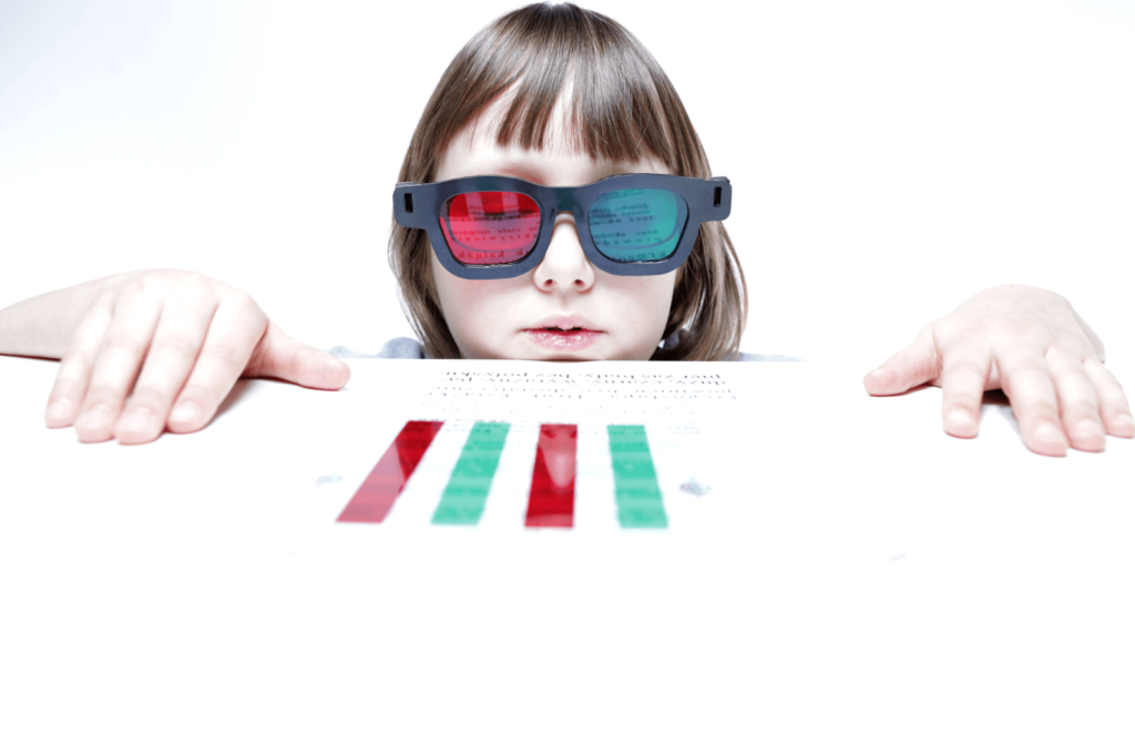 A young girl wearing filtered lenses to perform vision therapy exercise