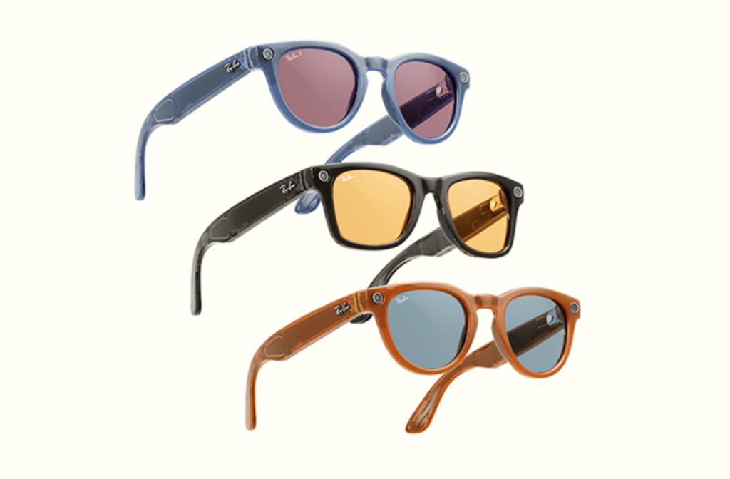 Three pairs of Ray-Ban Meta Smart glasses next to each other: one frame is blue, one is black, and one is orange