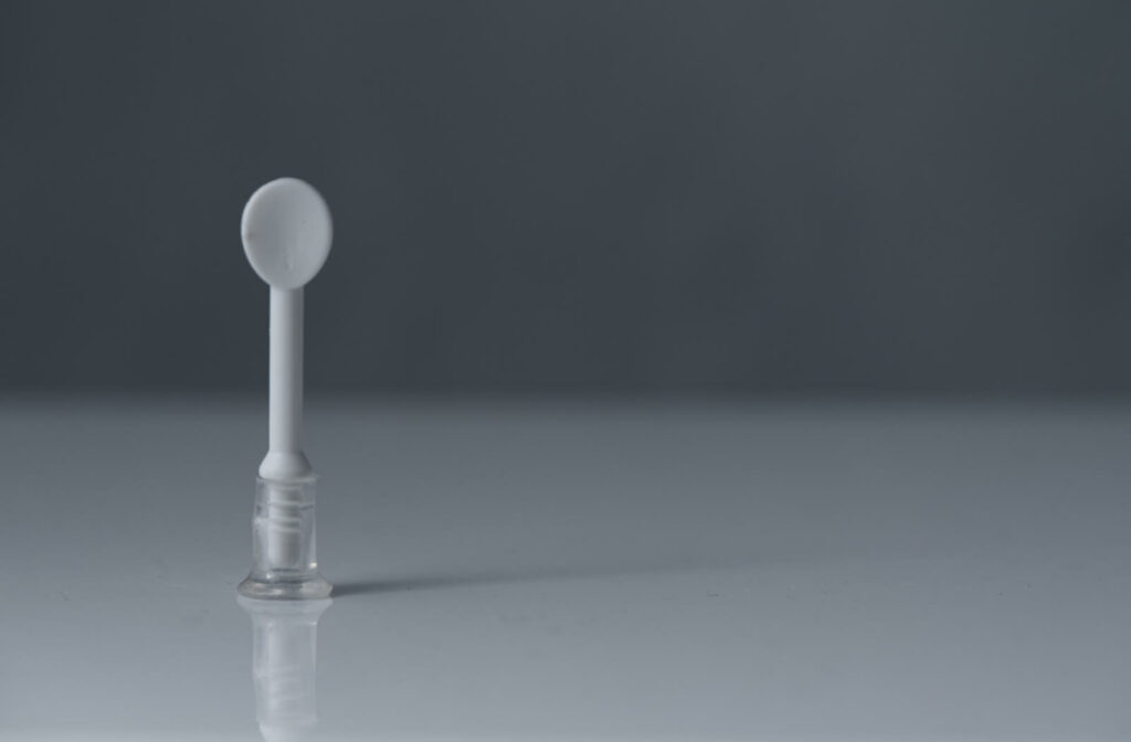 a scleral contact lens applicator is on a counter surface.