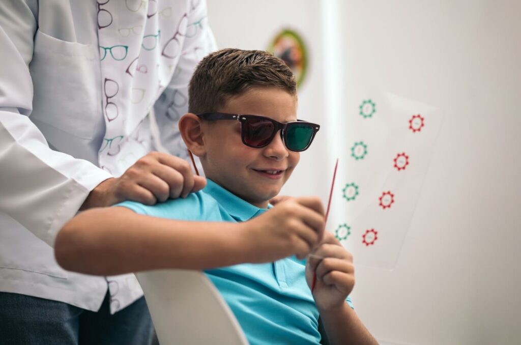 A young child completing activities in vision therapy to help improve strabismus.