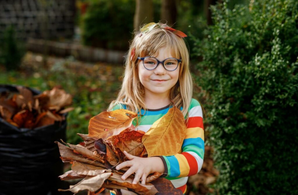 A young girl with myopia spending time playing outdoors