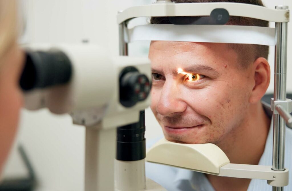 Person having an eye exam with a slit lamp to check for a solution to eye strain.
