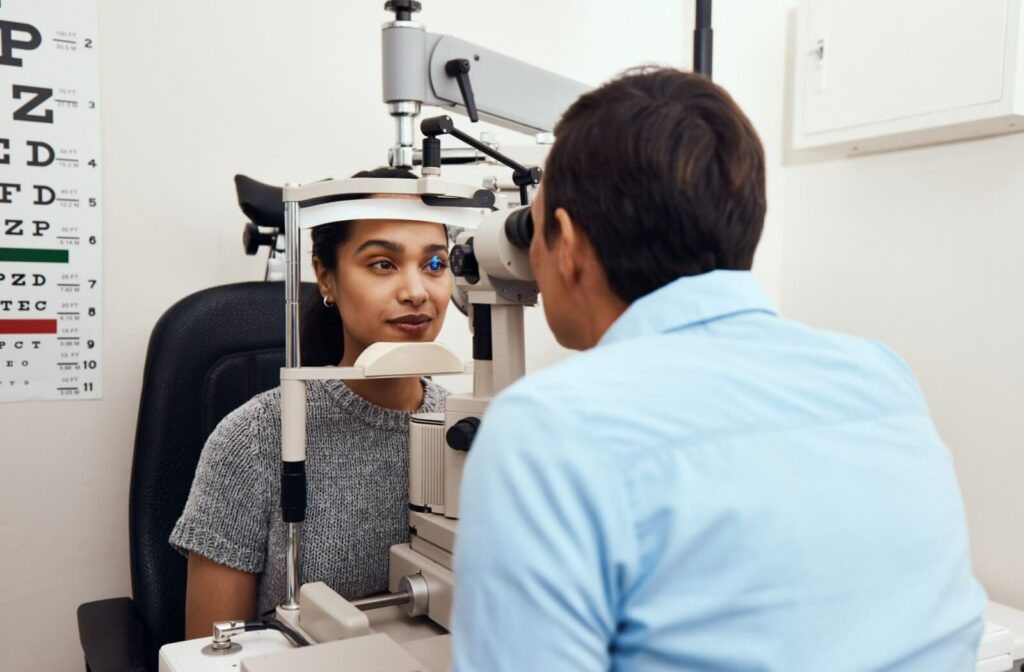 A person getting their eyes examined by an optometrist