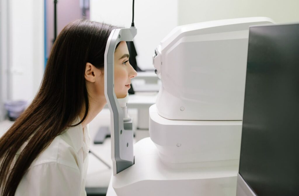A person sitting infront of an optical coherence tomography